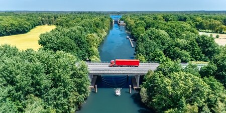 Bridge over canal with truck aerial drone view, dutch landscape, transportation concept, the Netherlands