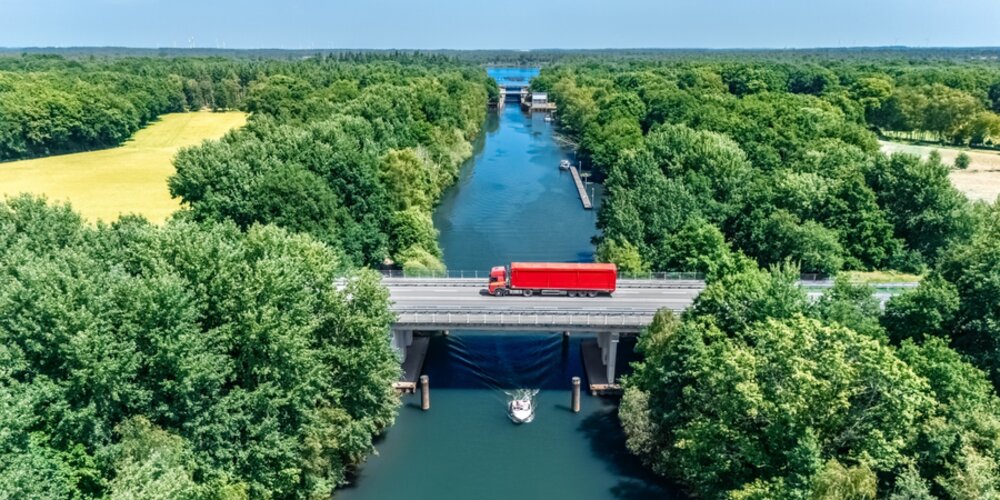 Bridge over canal with truck aerial drone view, dutch landscape, transportation concept, the Netherlands