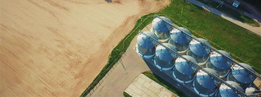 Bulk Grain Terminal From Above Green Fields And Storage