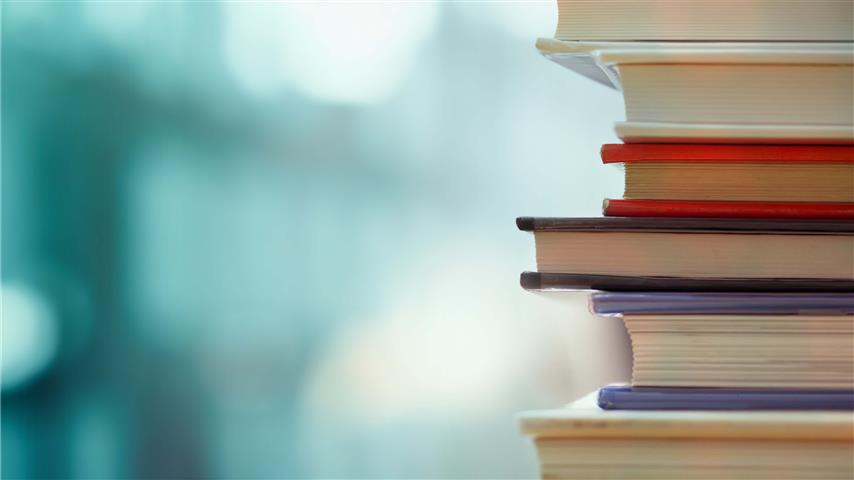 stacked books with blurred background_s